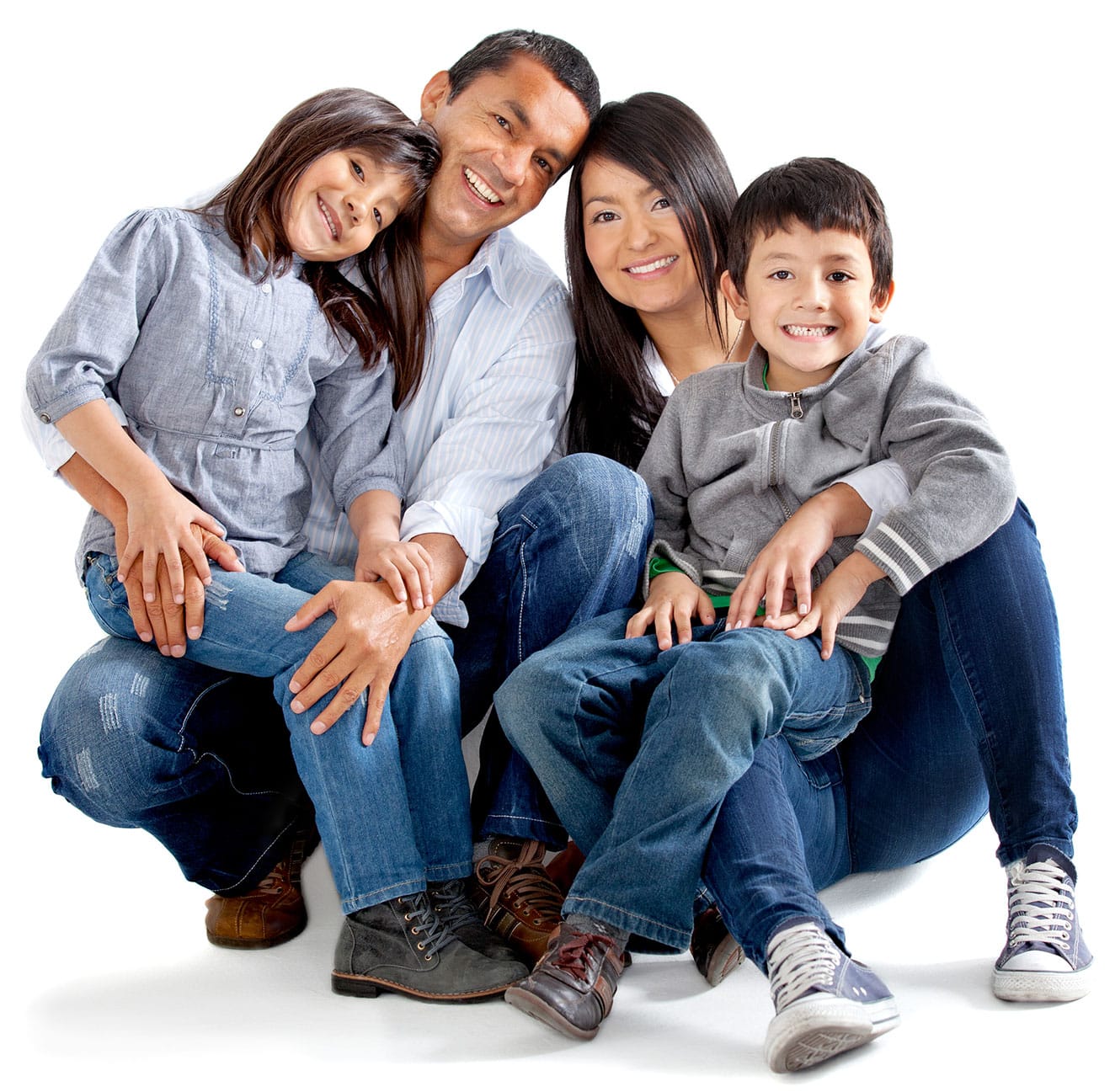A smiling Canada Family Class visa family of four, sitting closely together on a white background.